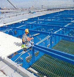 CSS Worksafe Installation Engineer laying out Uniline UNI8 Horizontal lifeline at Chelsea FC's new West Stand